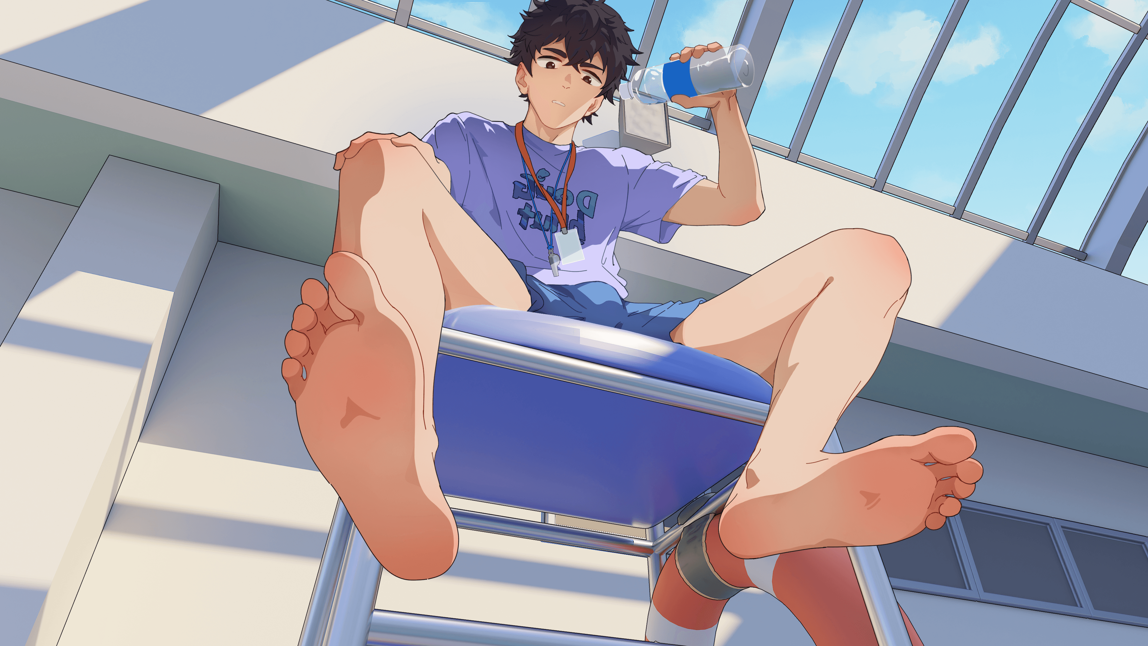 Julian Lian sitting in a sunlit school building